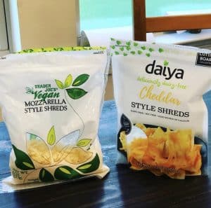 A bag of Trader Joe's Mozzarella Style Shreds and a bag of Daiya Cheddar Style Shreds