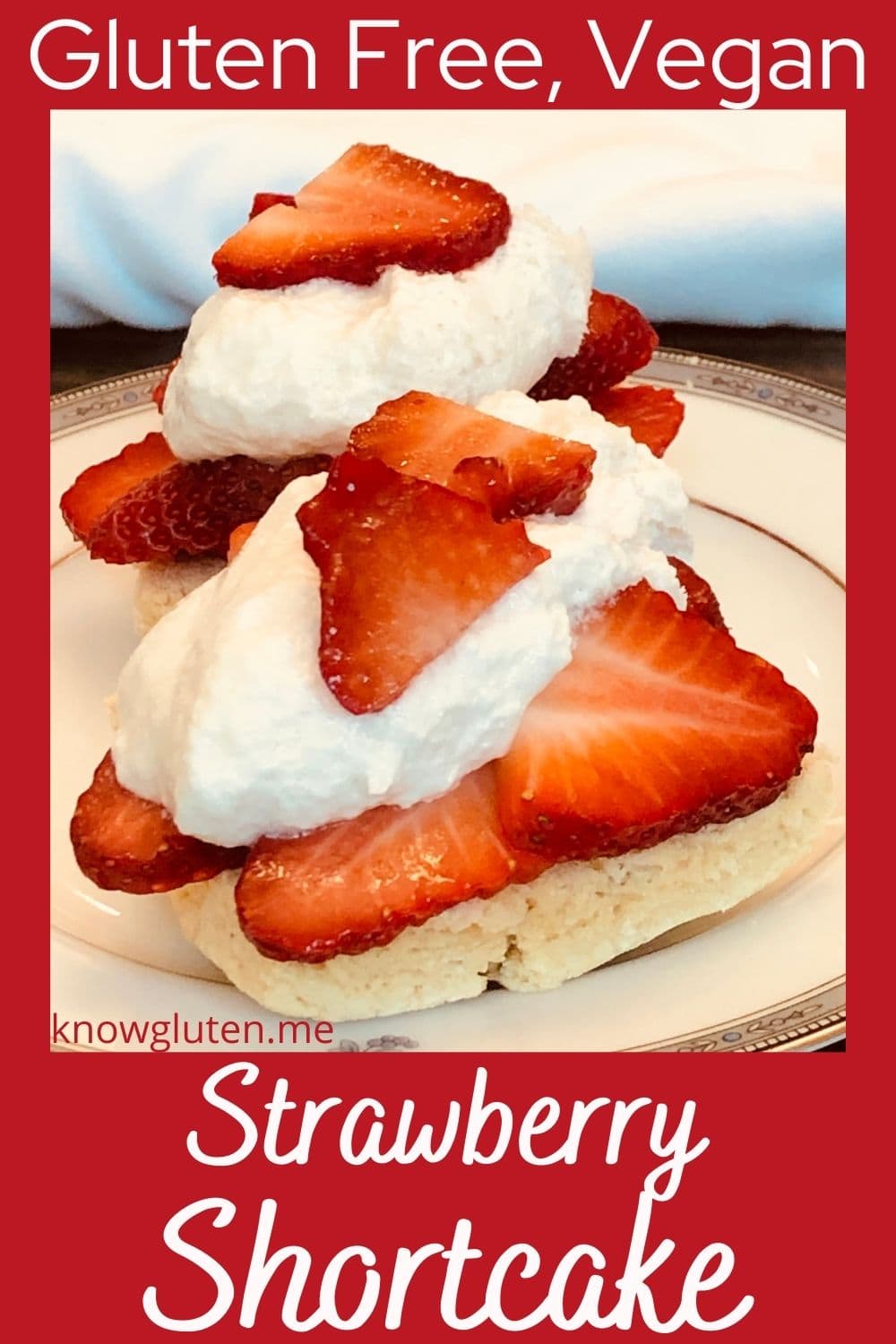 Two gluten free strawberry shortcakes on a china plate.