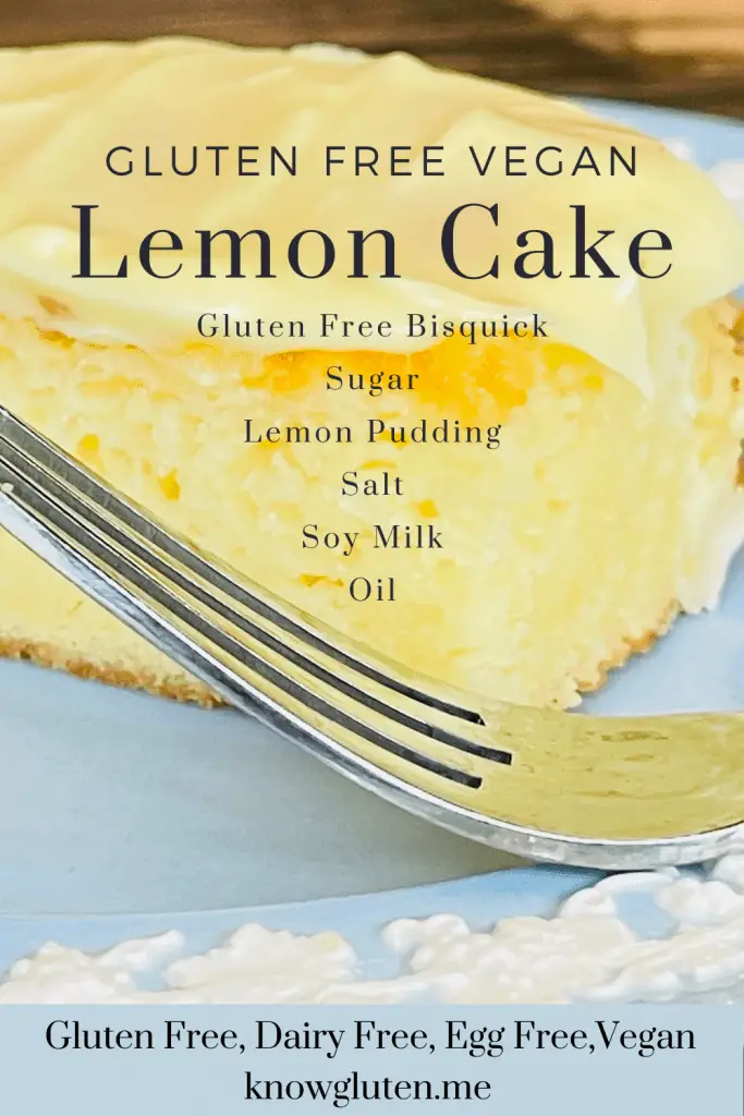 A piece of Gluten Free Lemon Cake on a blue plate with a fork beside it.