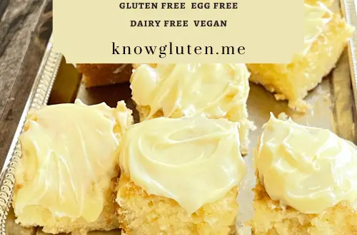 An overhead view of a tray of gluten free lemon cake cut into squares.